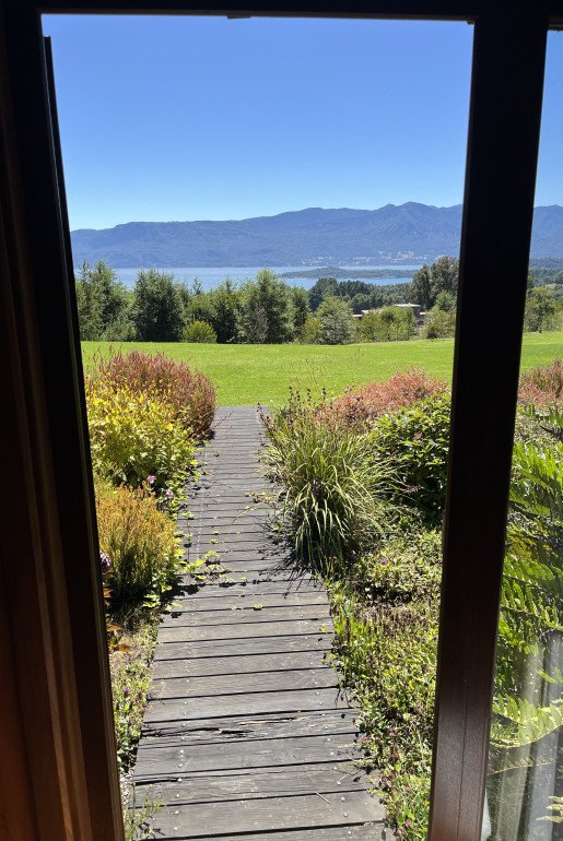 VIEW FROM DELUXE SUITES - Wake up to lush gardens and the tranquil lake beyond