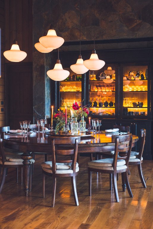 DINING ROOM - Framed by vintage glassware, high ceilings, and lake views