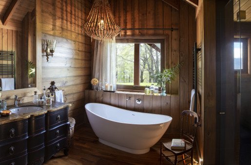 MASTER SUITE – BATHROOM  - A vintage-inspired ensuite with a soaking tub with a view, and separate shower